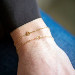 bracciali in oro 18kt con simboli filo