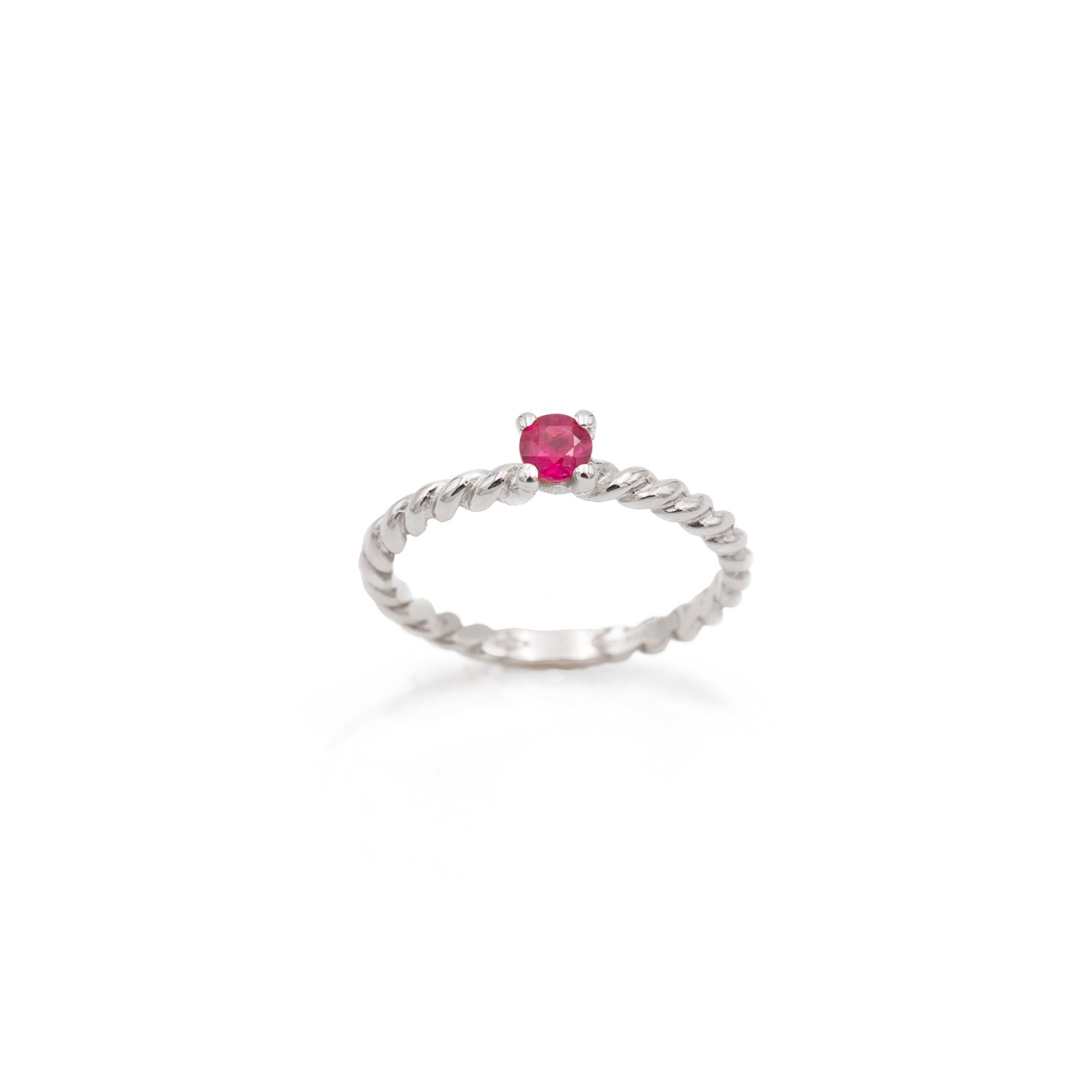 White gold braided ring with central ruby