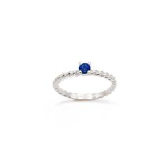 White gold braided ring with central sapphire