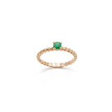 Braided rose gold ring with central emerald