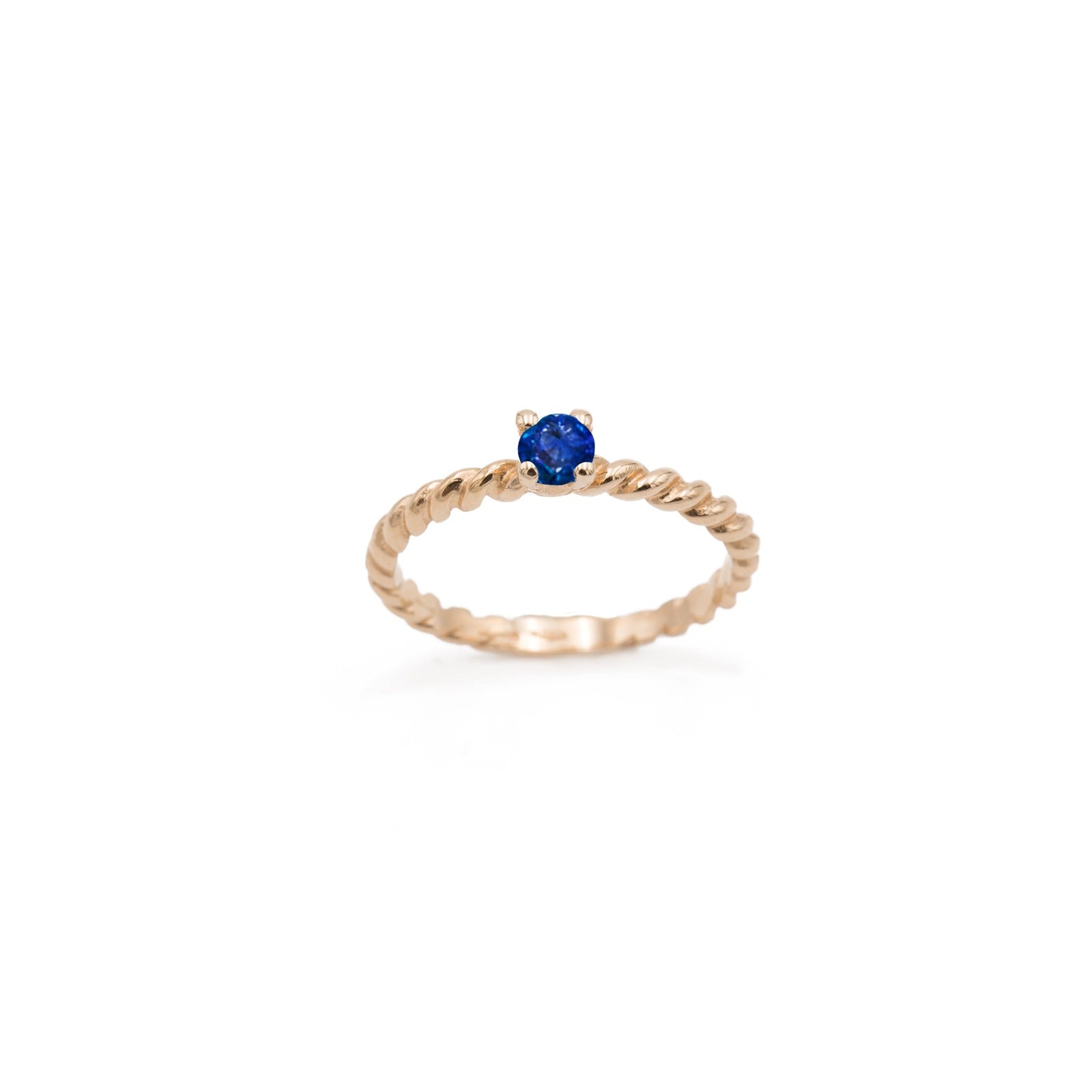 Rose gold braided ring with central sapphire